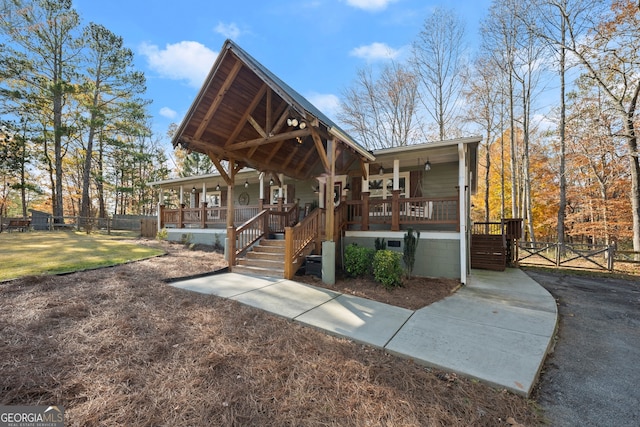 exterior space with covered porch and a garage