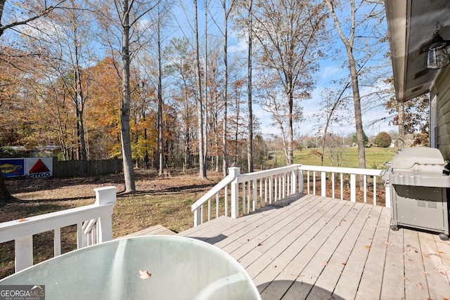 deck with a yard and a grill