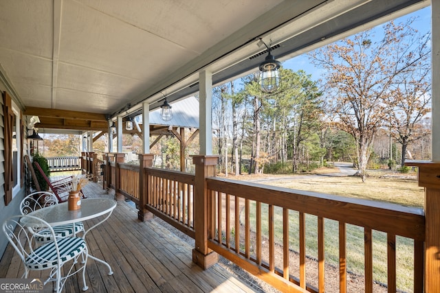 wooden deck featuring covered porch