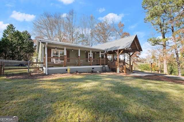 view of front of property with covered porch and a front yard