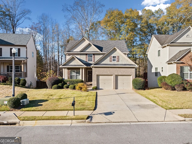 view of front of property featuring a garage and a front lawn