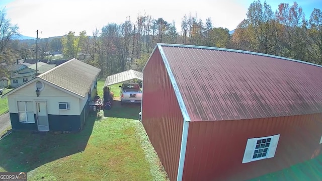 view of side of home featuring a yard