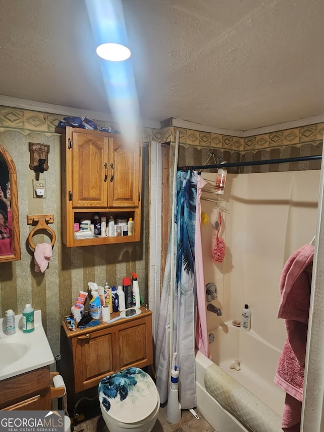 full bathroom featuring vanity, toilet, and shower / tub combo with curtain