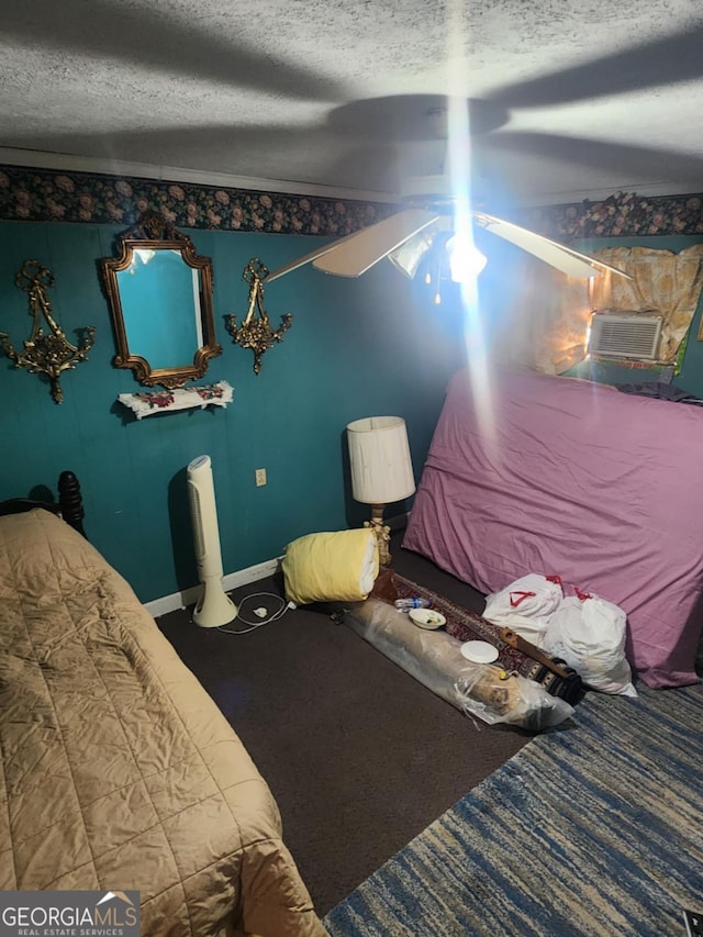 bedroom with carpet flooring, ceiling fan, and a textured ceiling