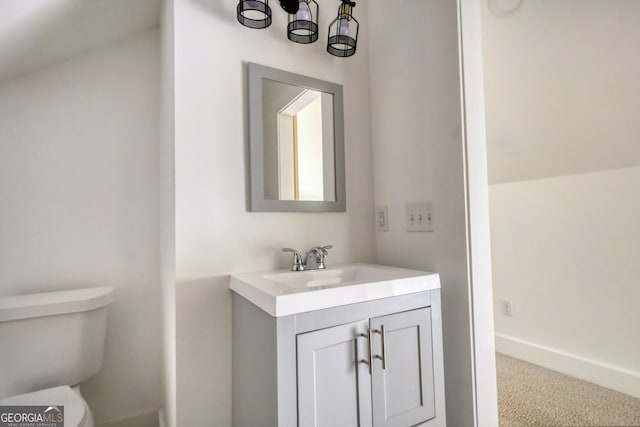 bathroom with vanity and toilet