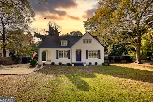 view of front of house with a yard