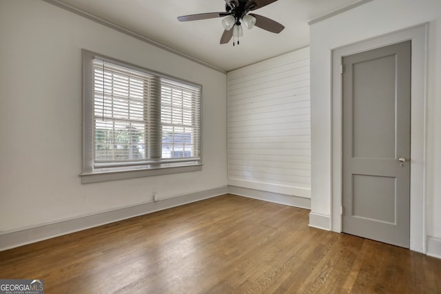 unfurnished room featuring ceiling fan and wood-type flooring