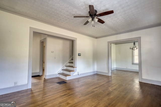 interior space featuring ceiling fan with notable chandelier, a textured ceiling, dark hardwood / wood-style floors, and crown molding