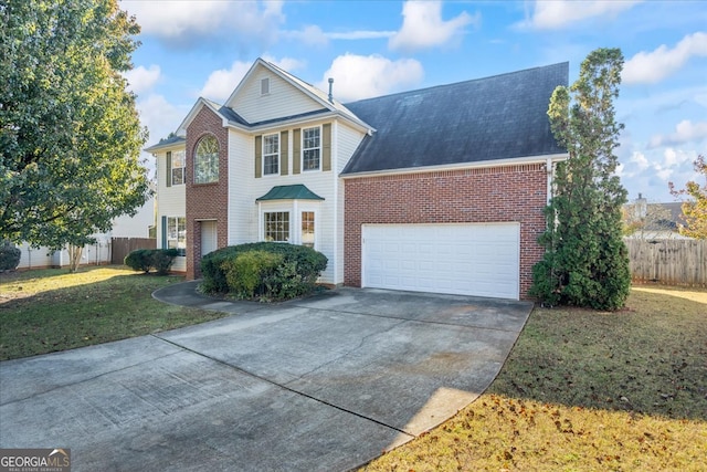 view of front property with a front yard and a garage