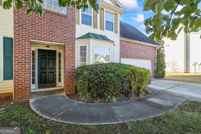 view of exterior entry featuring a garage