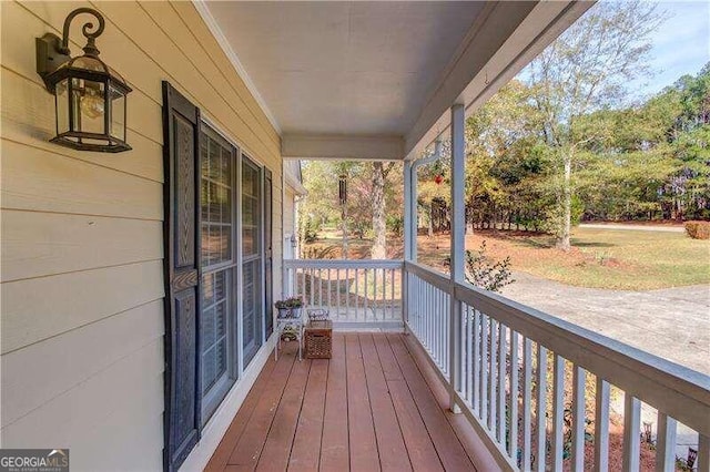 wooden terrace featuring a porch