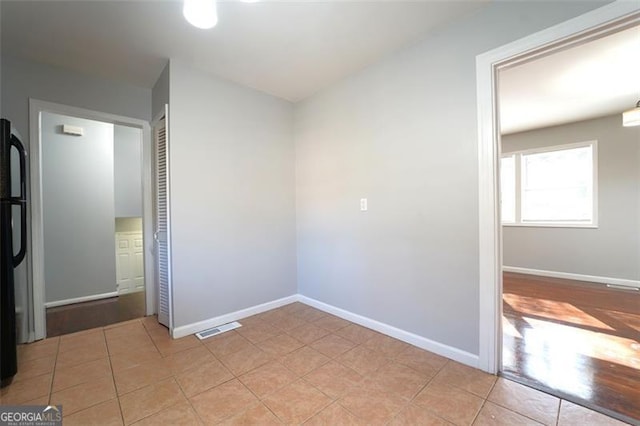 unfurnished room featuring light wood-type flooring