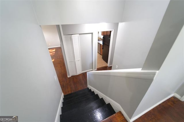 stairway with wood-type flooring