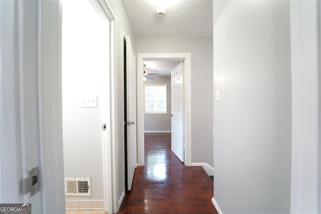 hall featuring dark wood-type flooring