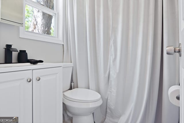 bathroom featuring vanity and toilet