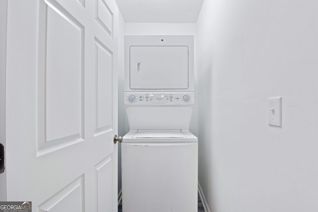 laundry area featuring stacked washer / dryer