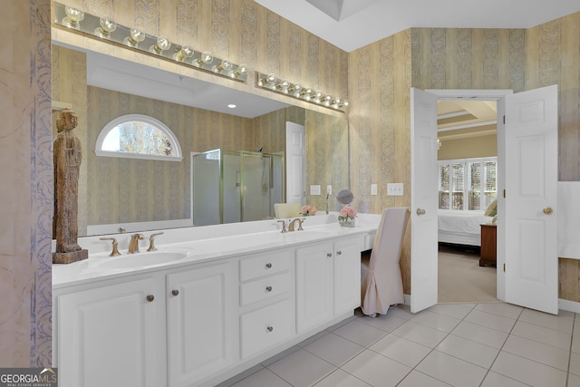 bathroom featuring tile patterned floors, vanity, and walk in shower