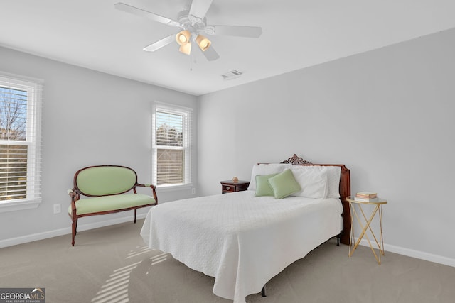 bedroom featuring light carpet and ceiling fan