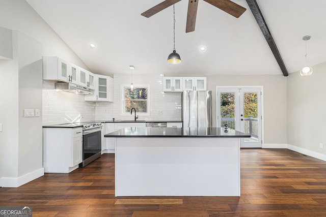 kitchen featuring decorative backsplash, appliances with stainless steel finishes, dark wood-type flooring, decorative light fixtures, and white cabinets