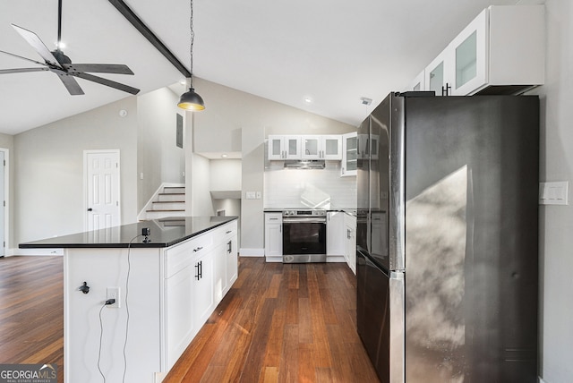 kitchen with dark hardwood / wood-style flooring, stainless steel appliances, lofted ceiling with beams, decorative light fixtures, and white cabinets