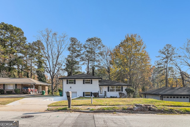 split level home featuring a front lawn