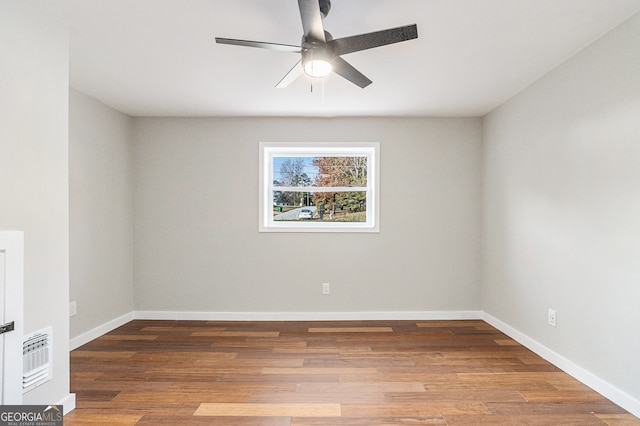 empty room featuring wood-type flooring and ceiling fan