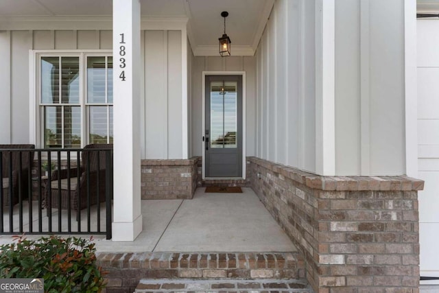 entrance to property featuring a porch