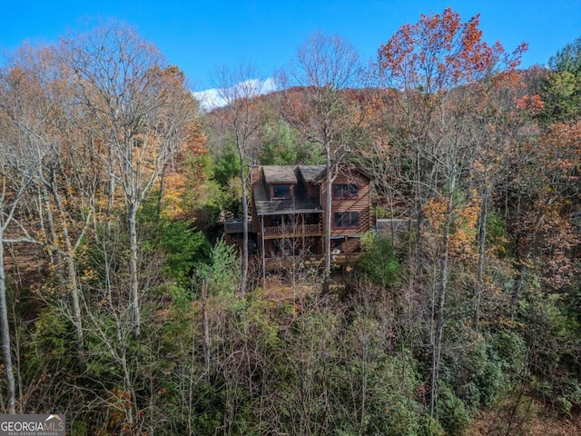 back of house featuring a deck with mountain view