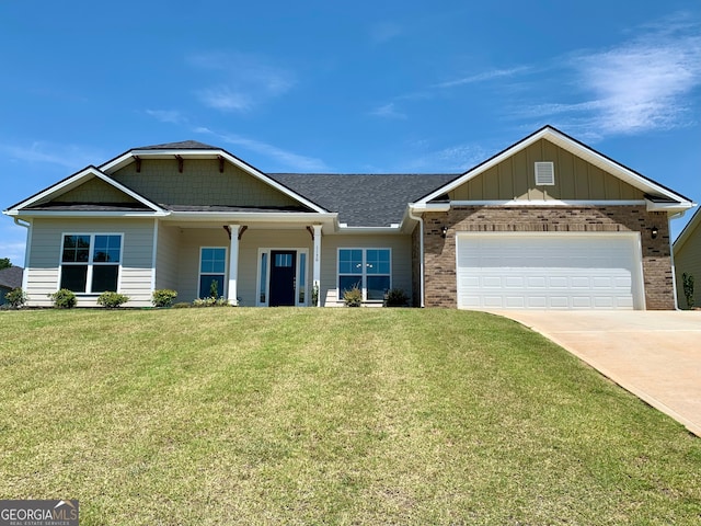 craftsman house with a front yard and a garage