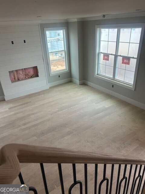 unfurnished living room with light hardwood / wood-style flooring