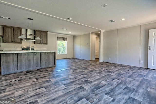 kitchen featuring ornamental molding, electric stove, dark wood-type flooring, and wall chimney range hood