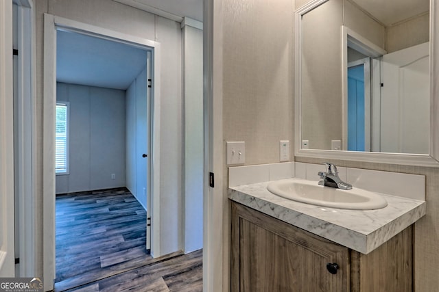 bathroom featuring hardwood / wood-style floors and vanity