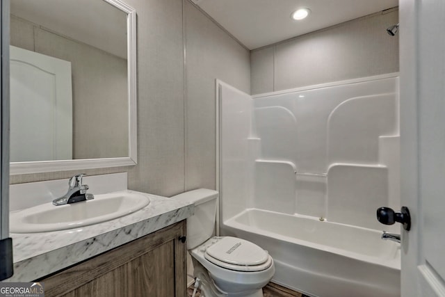 full bathroom with toilet, vanity, and tub / shower combination