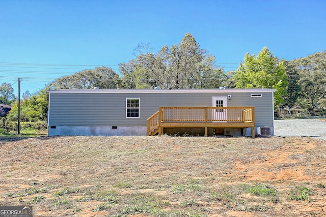 back of property featuring cooling unit and a deck