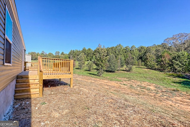 view of yard featuring a deck