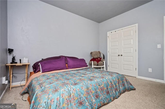 bedroom with carpet floors and a closet