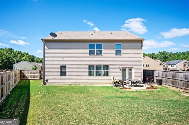 back of property featuring a patio, an outdoor fire pit, and a lawn