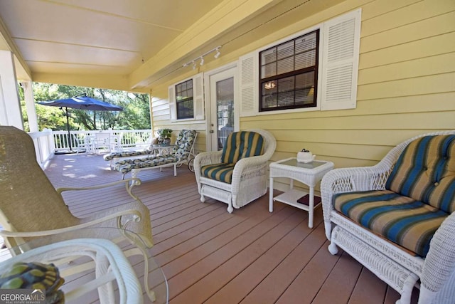 wooden deck featuring covered porch