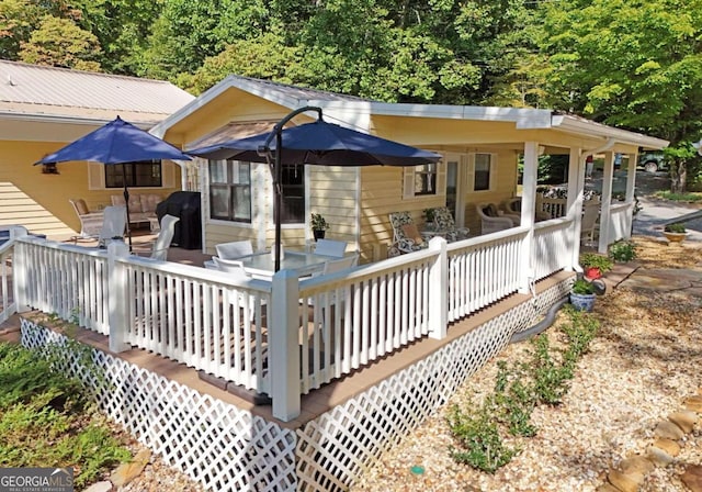 wooden terrace with area for grilling