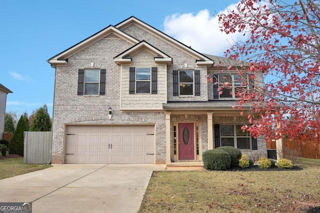 view of front of property with a front lawn and a garage