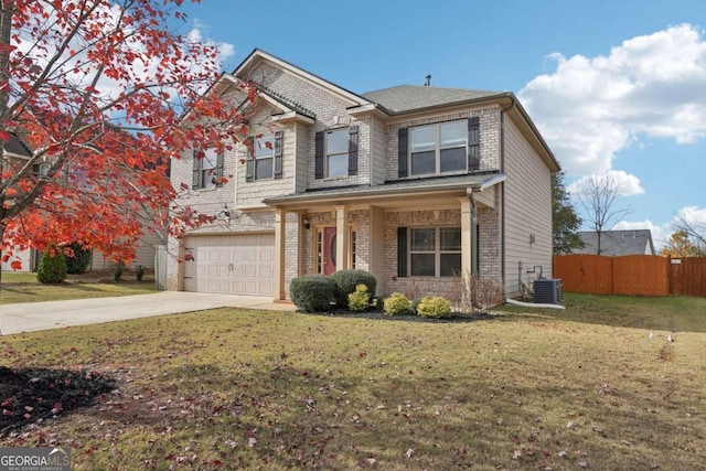 view of front of home with a front yard, central AC, and a garage