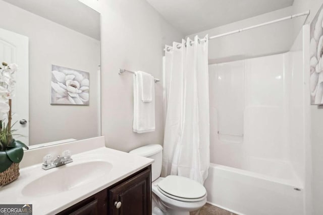 full bathroom featuring vanity, shower / bath combo, and toilet