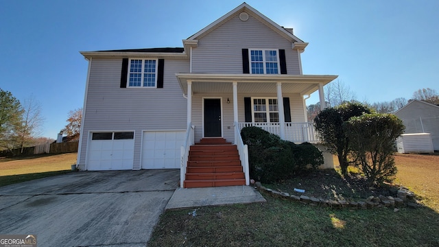 view of front of property with a porch and a garage