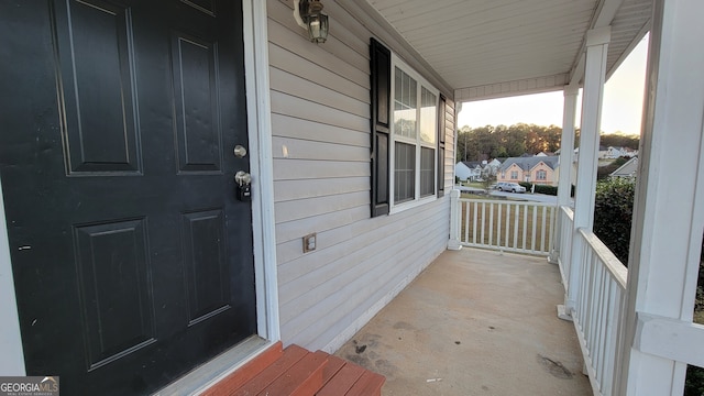 doorway to property with a porch