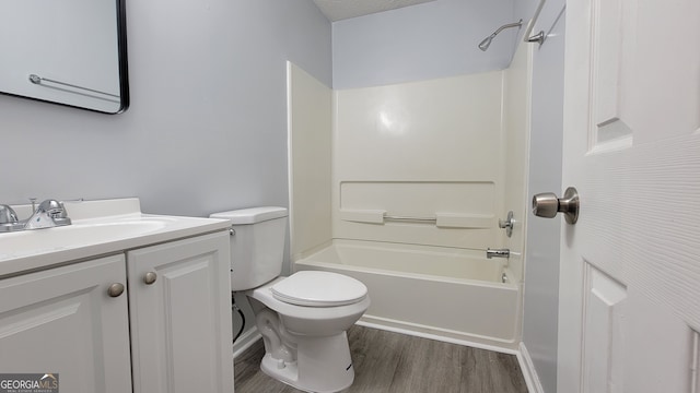 full bathroom featuring toilet, vanity, tub / shower combination, and hardwood / wood-style flooring