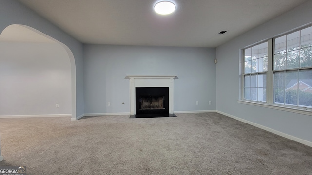 unfurnished living room with carpet