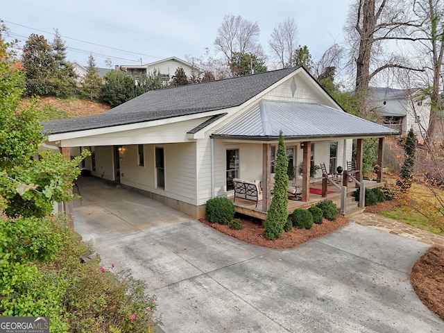 view of front facade with a carport and covered porch