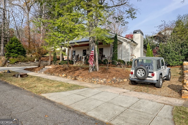 obstructed view of property featuring a porch