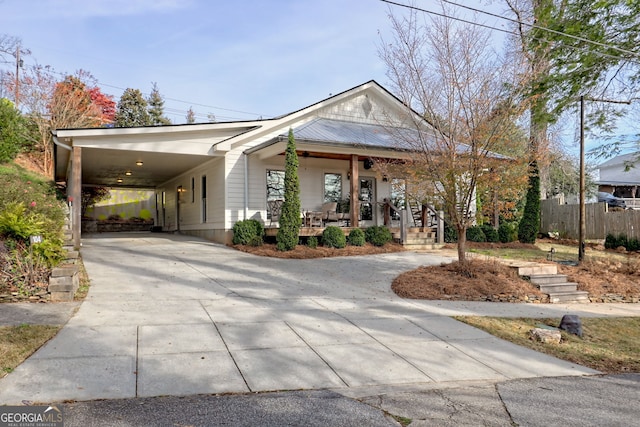 view of front facade with a porch and a carport