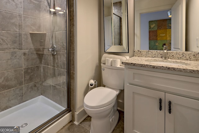 bathroom with toilet, walk in shower, and vanity